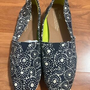 TOMS Black and White Sunburst Slip-Ons